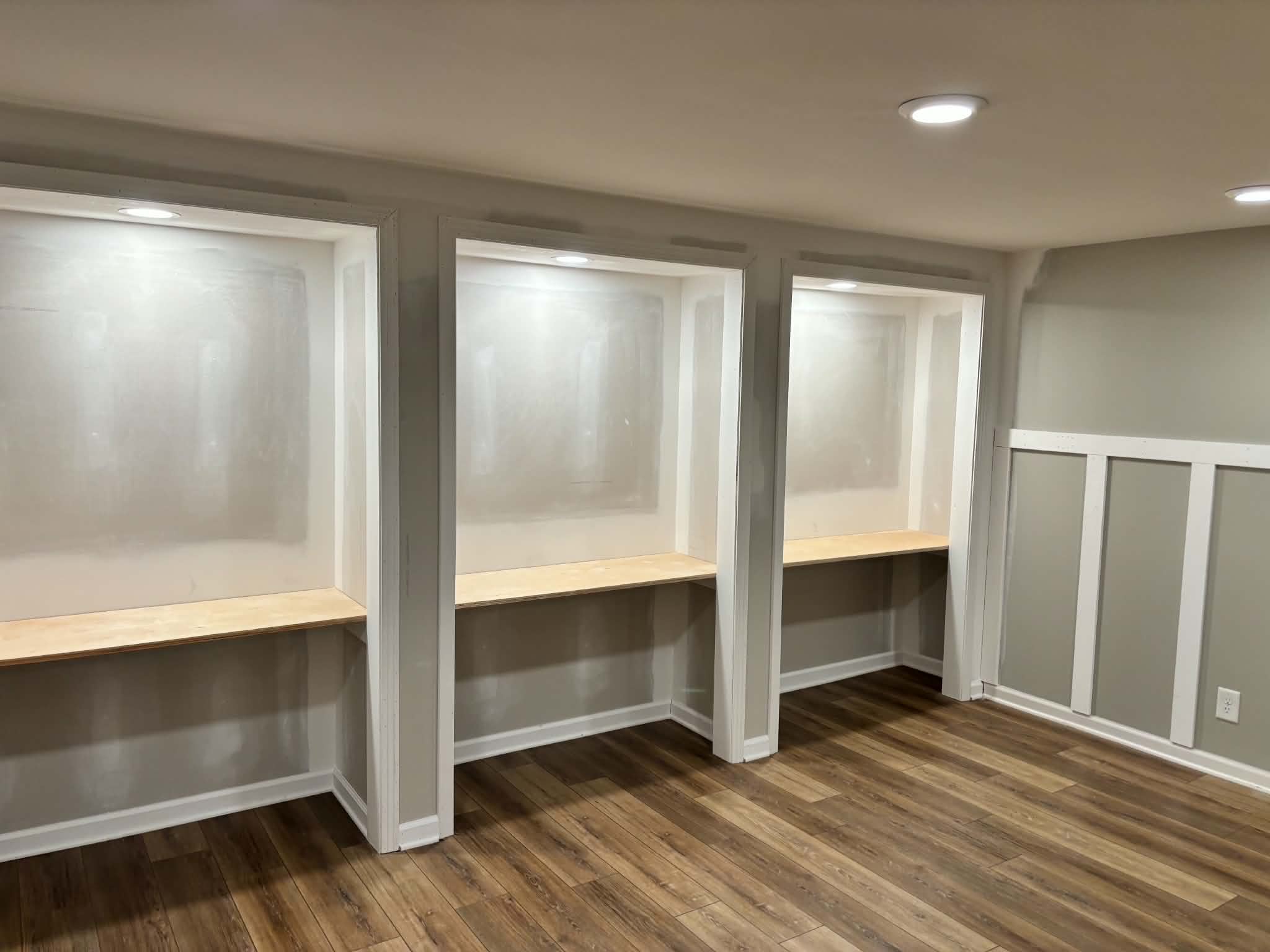 Custom built-in desk nooks with recessed lighting in finished basement by Henning Construction in Middle Tennessee