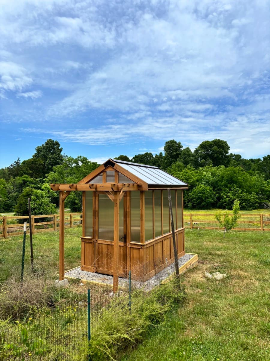 Custom cedar and polycarbonate greenhouse built by Henning Construction in Middle Tennessee