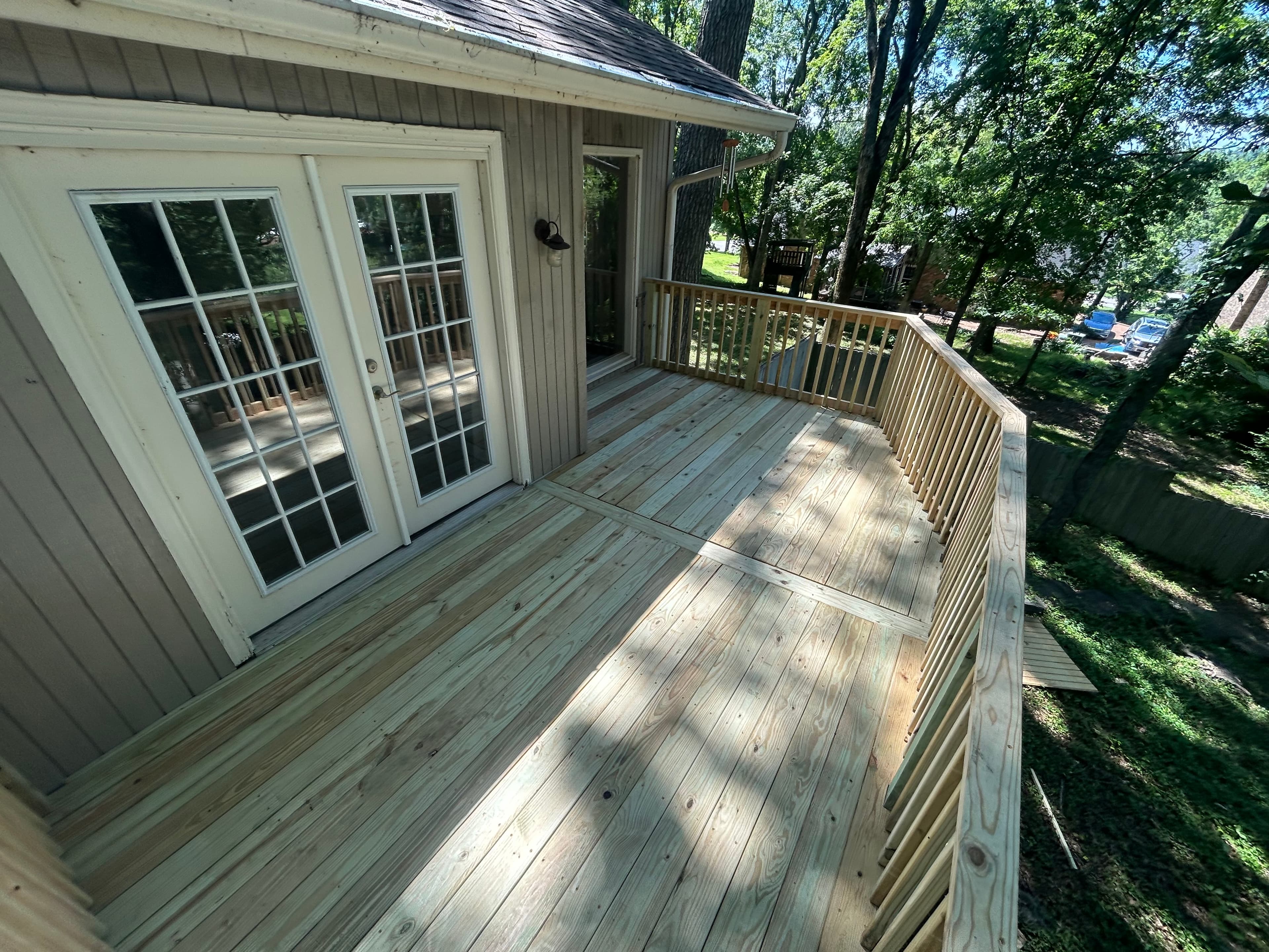 Custom pressure-treated deck off french doors in Middle Tennessee