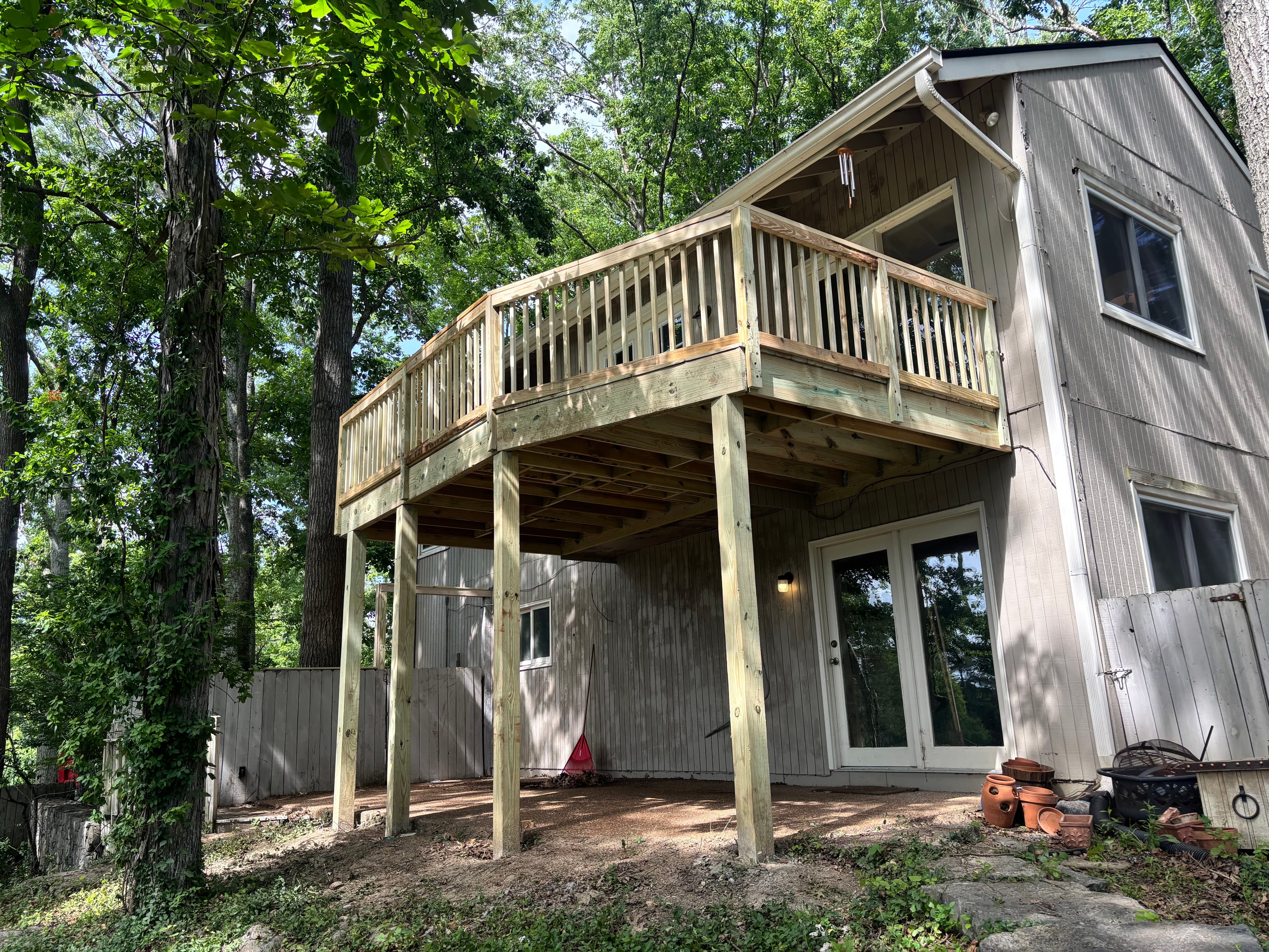 Elevated pressure-treated deck on A-frame home, approximately 15 feet off ground, Middle Tennessee