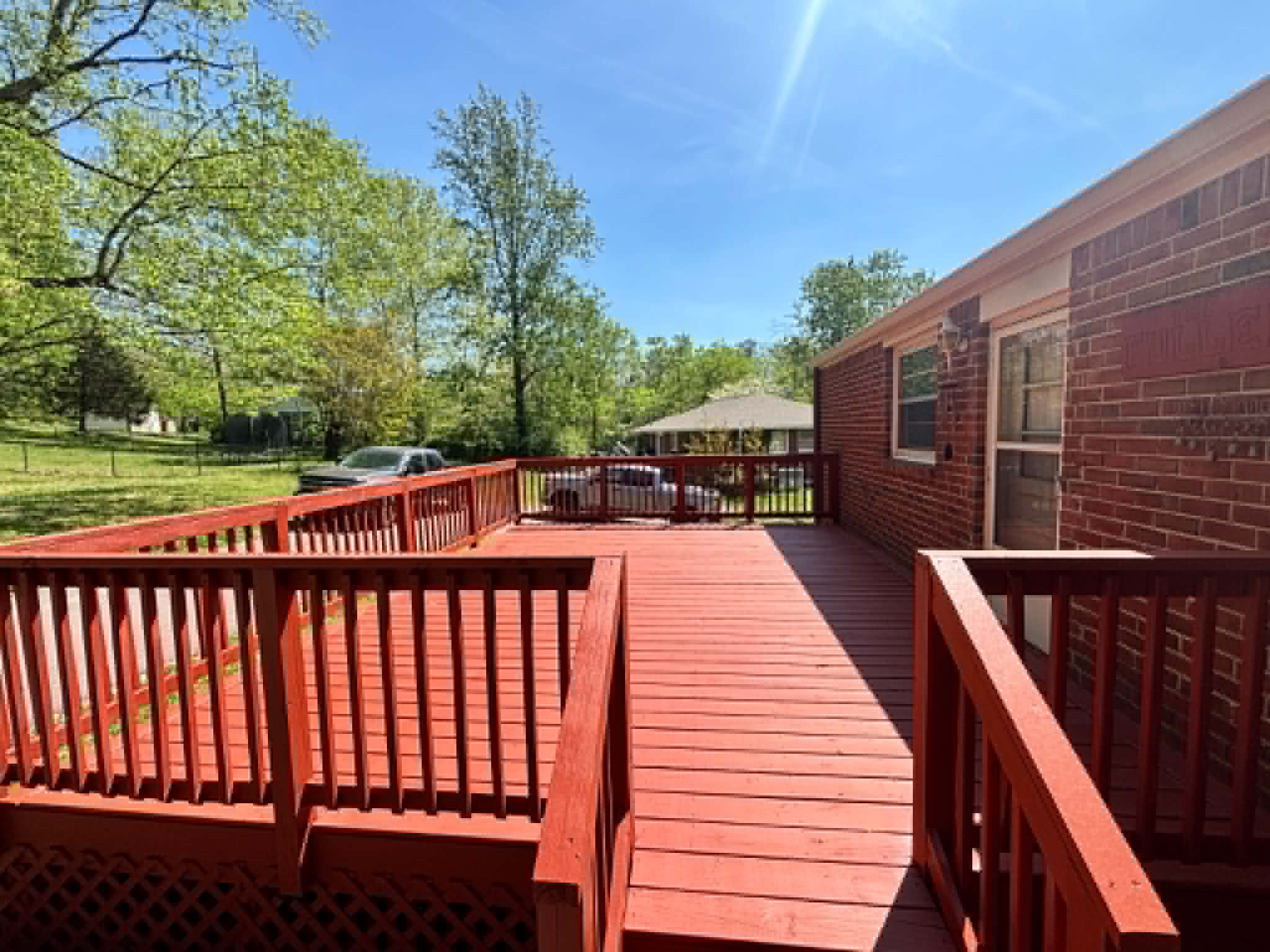 Stained deck with red railing in Middle Tennessee