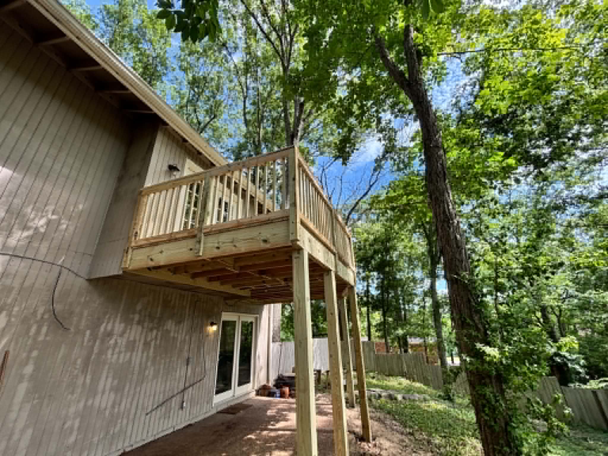 Elevated two-story deck with long staircase built by Henning Construction in Middle Tennessee