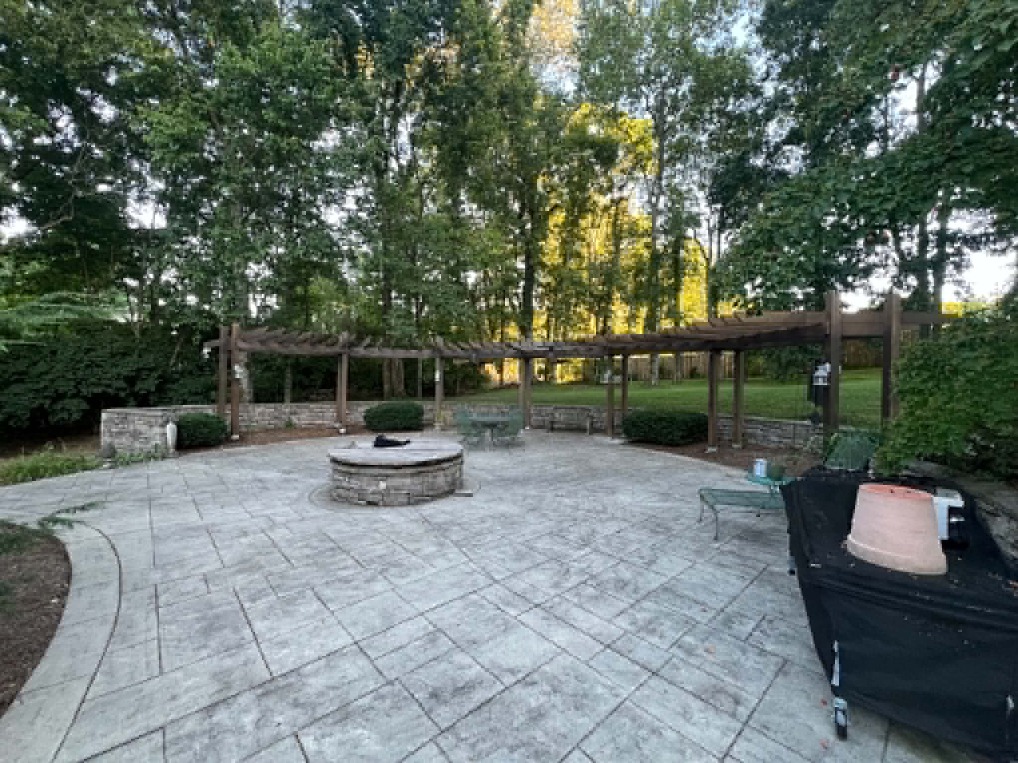 Stamped concrete patio with stone fire pit in Middle Tennessee